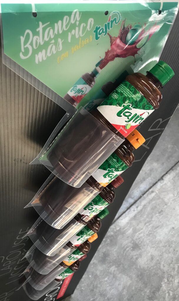 . Tira de impulso para punto de venta con blisters transparentes y cabecera gráfica.